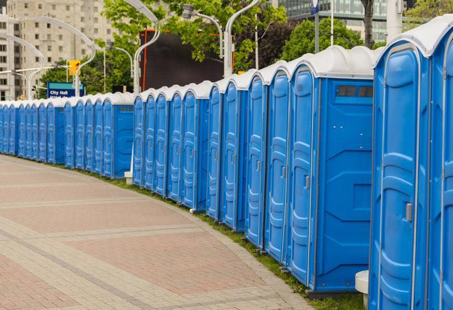 a line of portable restrooms at an outdoor wedding, catering to guests with style and comfort in Adair Village OR